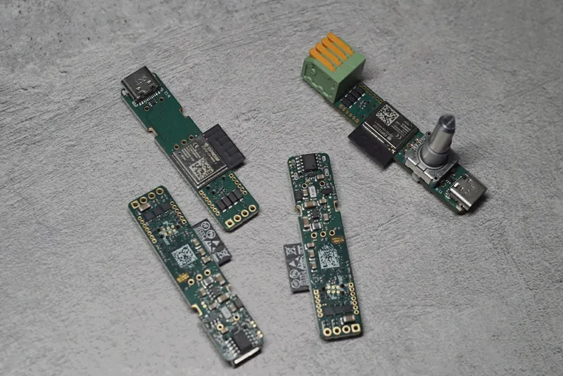 Four boards, top and bottom sides; one fully assembled.